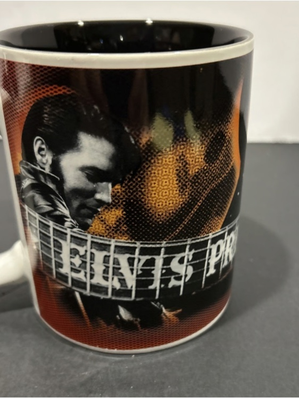 Collectible Black and Orange Ceramic Mug with Graphic Portrait